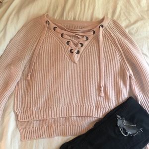 Pink lace-up sweater